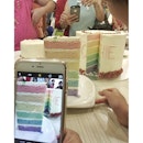 The 'white' cake is actually a 'rainbow'  7inch tall bottom layer.