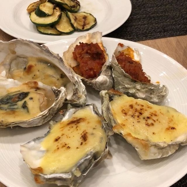 Assorted baked oysters and surf and turf, which is quite yums.