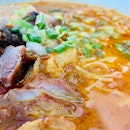Char siew & siew yoke curry laksa is as indulgent as it sounds.