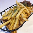 Truffle Fries Tossed In Parmesan Cheese ($10).