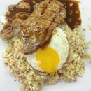 Fried rice perfumed with plenty of wok hei, sunny side up with oozy yolk, and grilled pork with sexy score lines and drowned in brown sauce...#dinner's ready!